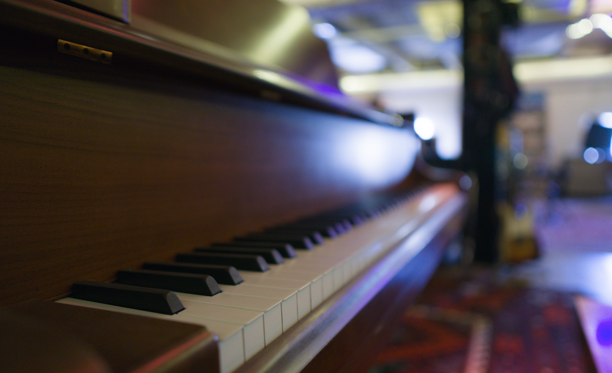 a dramatic shot down a piano keyboard