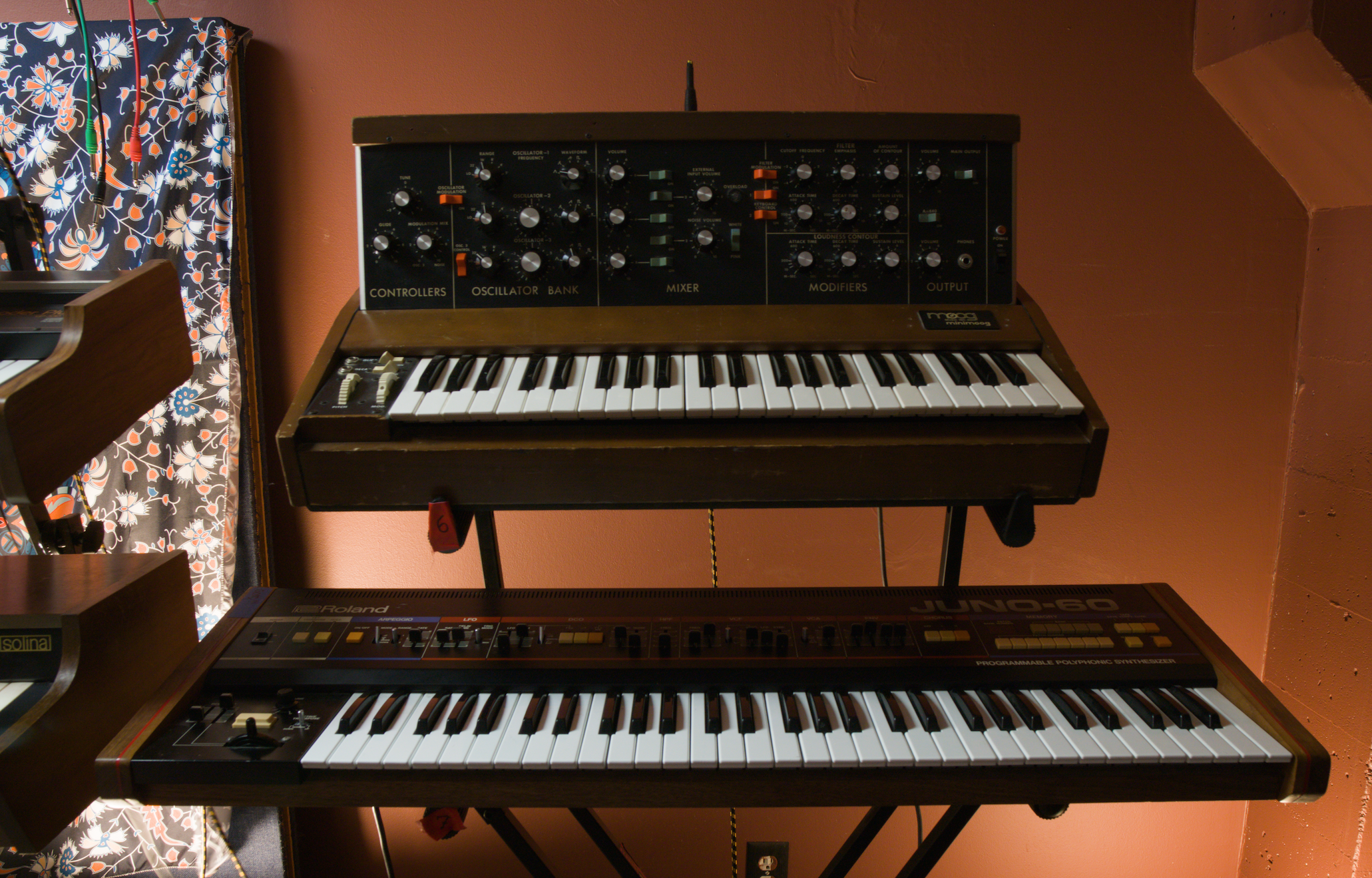 a Moog and a Roland synthesizer inside Echo Echo recording studio
